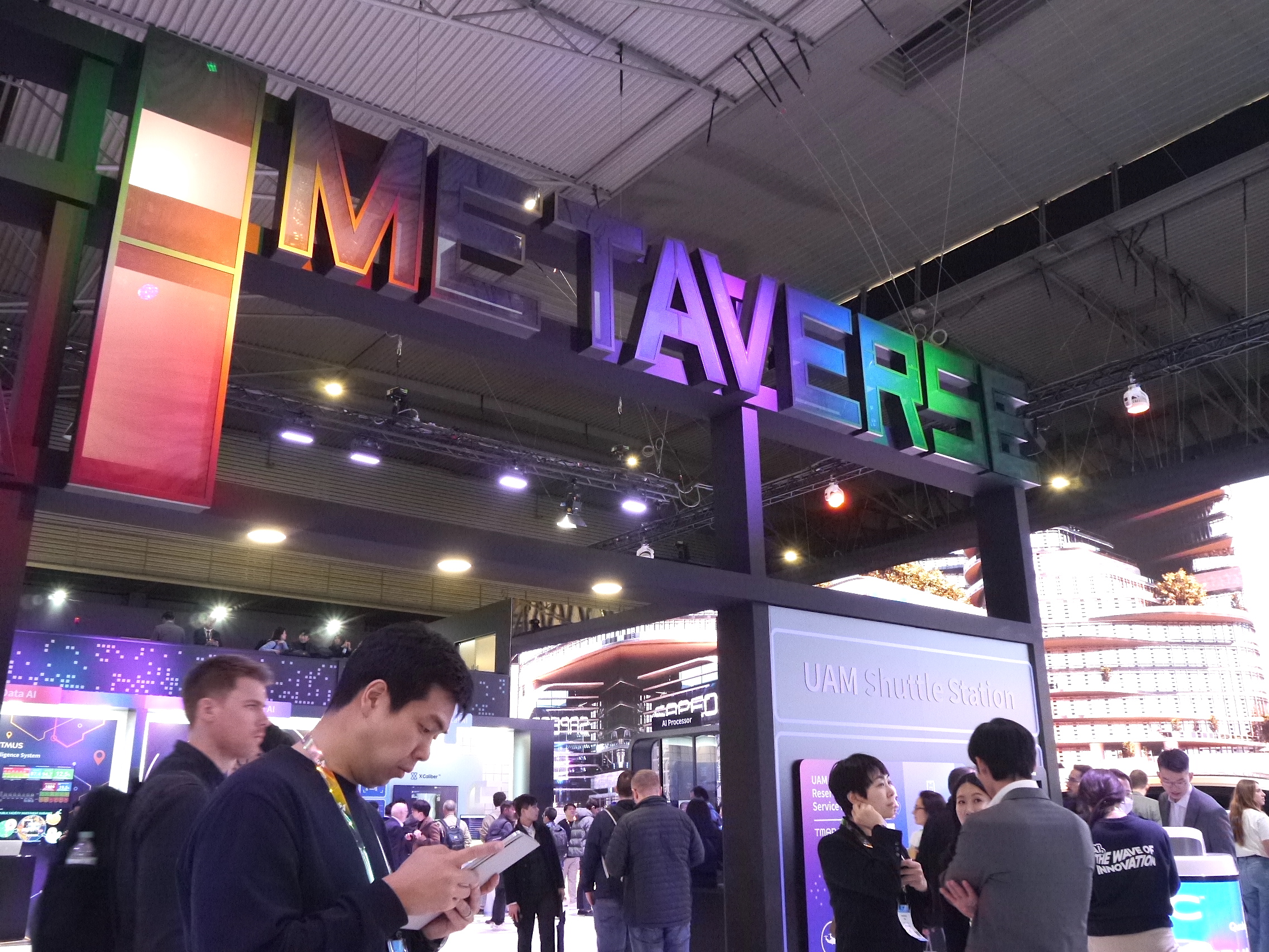 A colorful 'Metaverse' logo is shown atop a booth at the MWC 2023 trade show in Barcelona